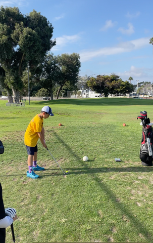 Golf Upgrades students hitting a tee shot at Mission Bay Golf Course in San Diego