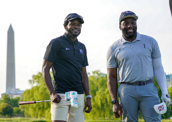 A golf instructor finishes a lesson with his student