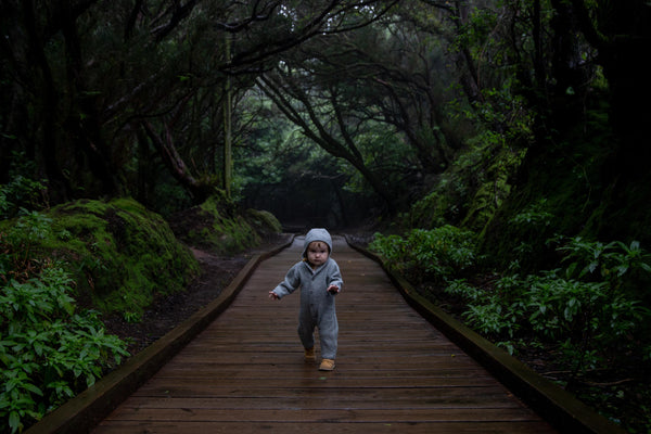 A child going through a metaphorical bridge symbolizing their faith in their journey