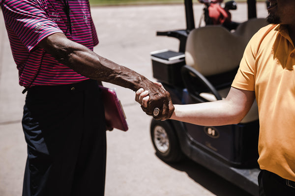 Playing partners developing a sense of camaraderie in the golf course