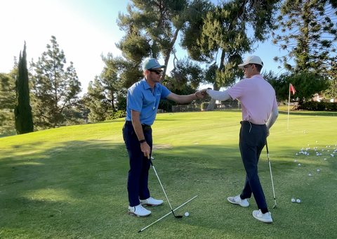 Golf Upgrades Golf Instructor Fist bumping Student During Golf Lesson