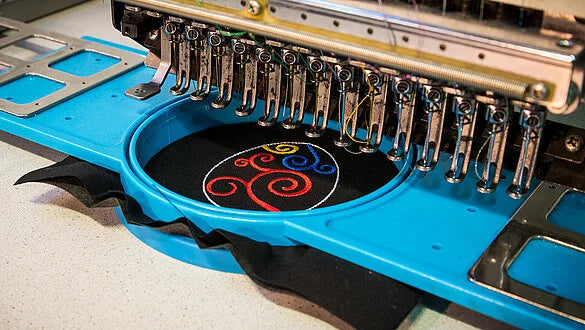 embroidering with threads made of recycled PET bottles