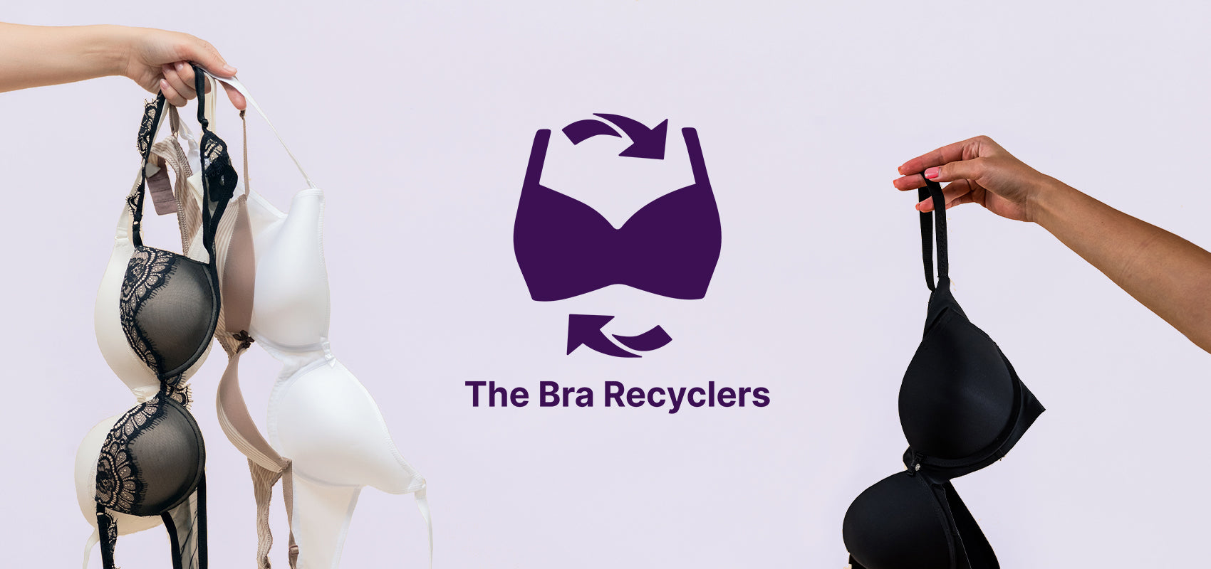 Holding bras in hands to donate