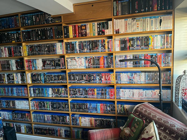 A photo of a large collection of Blu-rays on bookshelves.