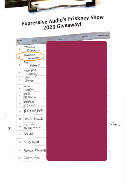 A scanned image of a clipboard with a sheet of paper on it. At the top are the words "Expressive Audio's Friskney Show 2023 Giveaway!" Below that is a table with columns for "Entry No.", "Name", "Email", "Phone" and "Newsletter?" The filled in columns have all been blocked off with a burgundy rectangle apart from the entry numbers and the names, and there is an orange oval around the second name.