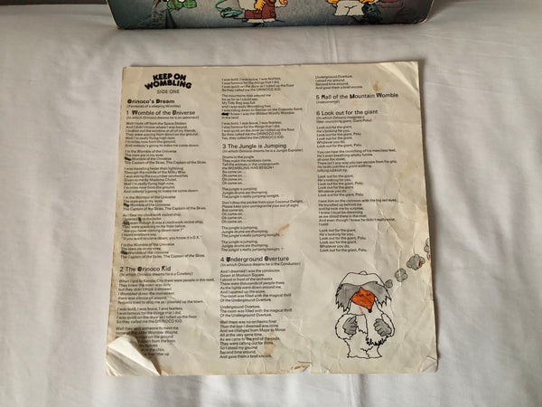 A photo of the first side of the lyric sheet for the vinyl record of 'Keep On Wombling' by The Wombles.