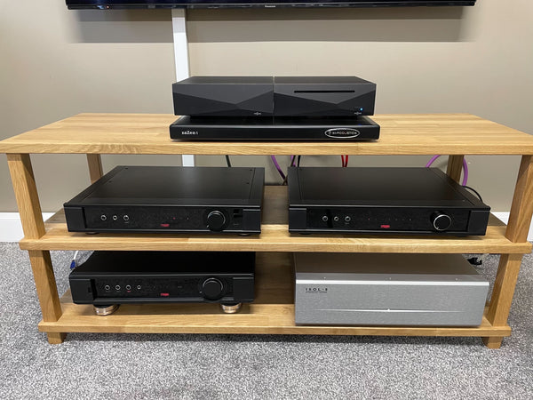 A set of HiFi products arranged on a pale coloured wooden rack.