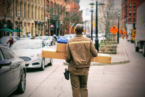 man outside holding things