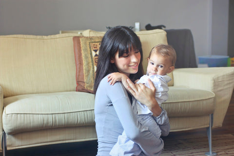 mother lifting child