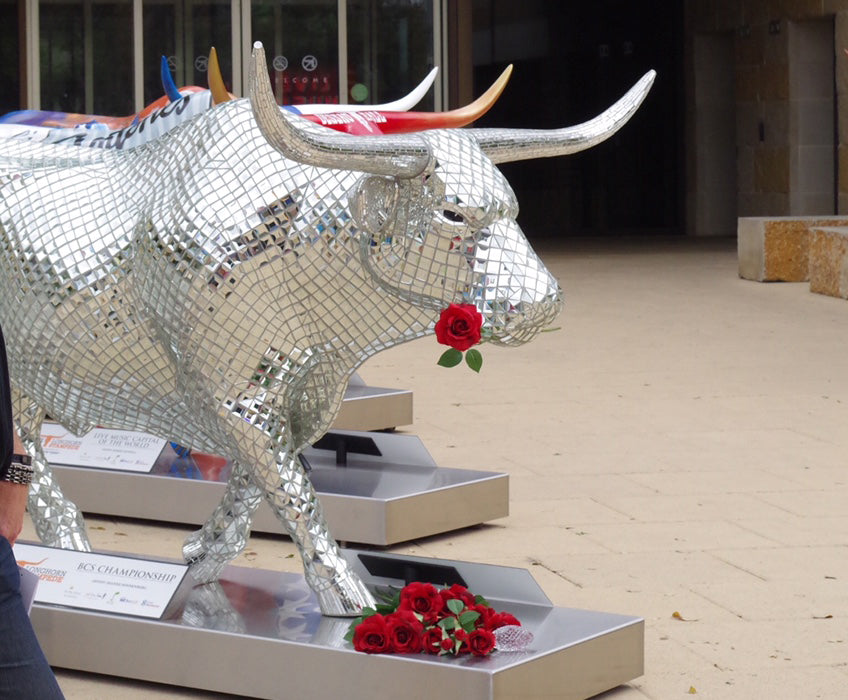 “Tex, the BCS Championship Longhorn” by Dianne Sonnenberg was created for the Texas Stampede for Children, a public art/auction event sponsored by Matthew McConaughey, Jack Ingram and Mack Brown to raise money for children’s charities.  The life-sized longhorn featured beveled mirror and water glass mirror to represent the Waterford Crystal Trophy won by the Texas Longhorn football team at the Rose Bowl Championship.  This mosaic raised a staggering $250,000 for charity, the most ever for an event of this kind.