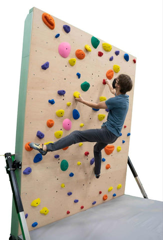 Climber on the EverActive Junior home climbing wall