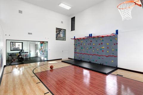 Home climbing wall in sport court