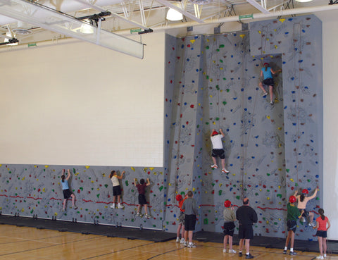 Children climbing on a K12 School Combi Wall by Everlast Climbing