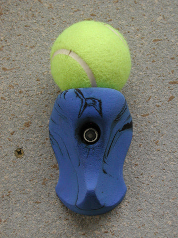Ball holder hand hold for use on a climbing wall