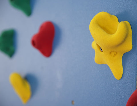 Close up of hand holds on a Chroma Wall by Everlast Climbing