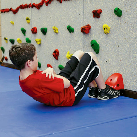 Boy doing exercises using the StartFIT Fitness System by Everlast Climbing