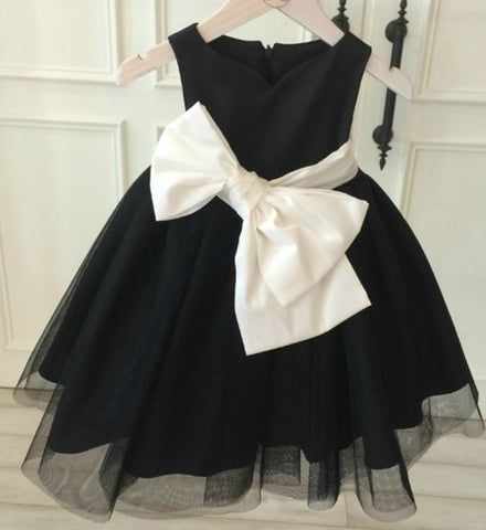 black dress with white bow on front