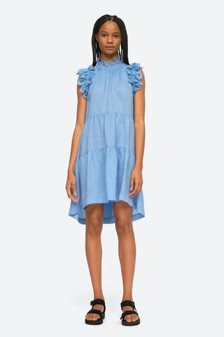 Lee embroidery tunic in sky with high ruffle neck, flutter sleeves and eyelet detailing