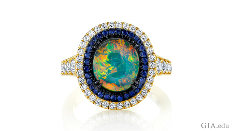 Omi Prive Opal ring with sapphires and diamonds in 18k yellow gold