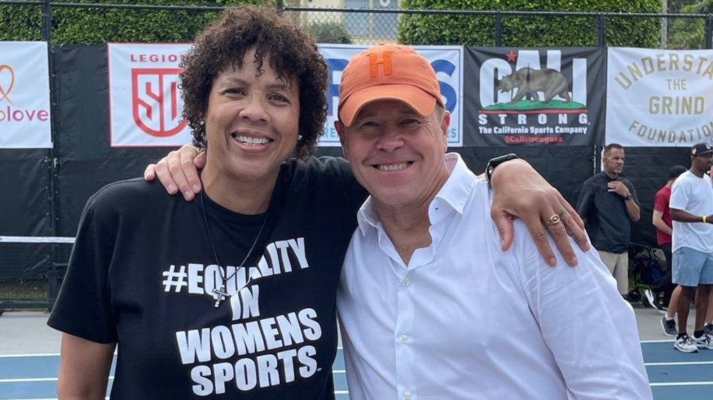 Cheryl Miller at the 2nd Annual CALI Strong Games event in 2023 with John Cahalin, founder of Real World Scholars non-profit. NFL HOFer Andre Reed and NFL alumni Antoine Cason in the background.