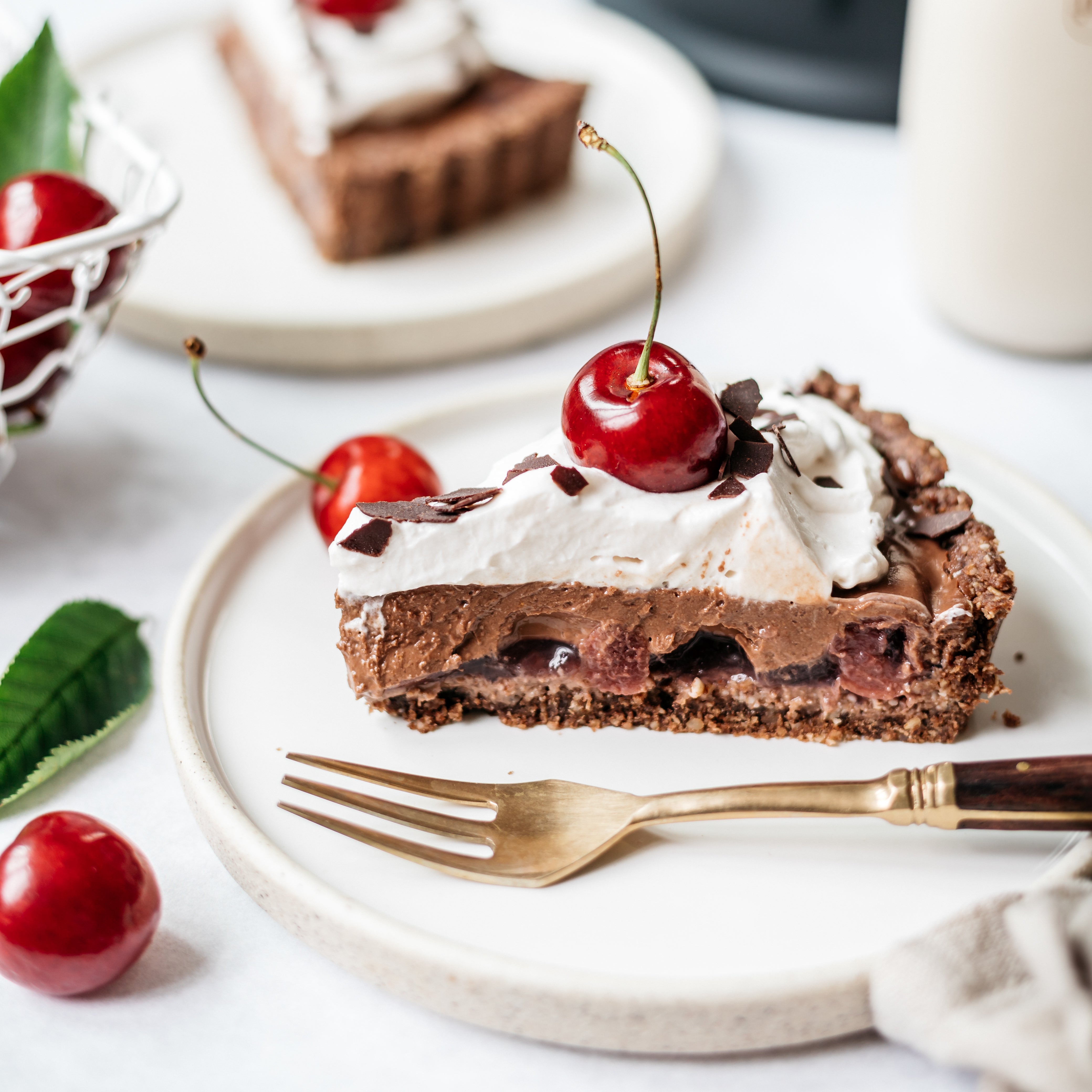 Black Forest Tart slice on plate with fork