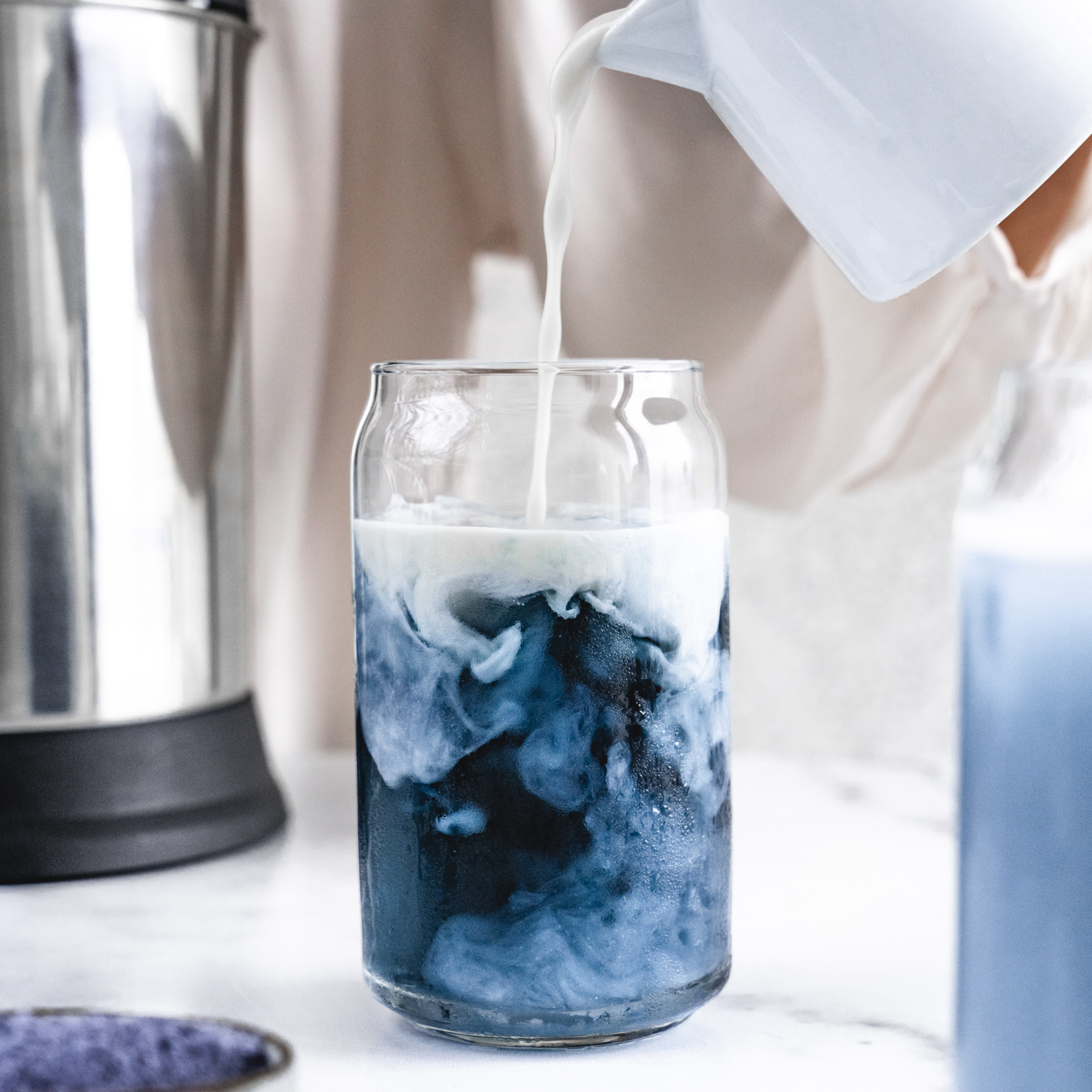 plant-based blueberry iced latte in a glass