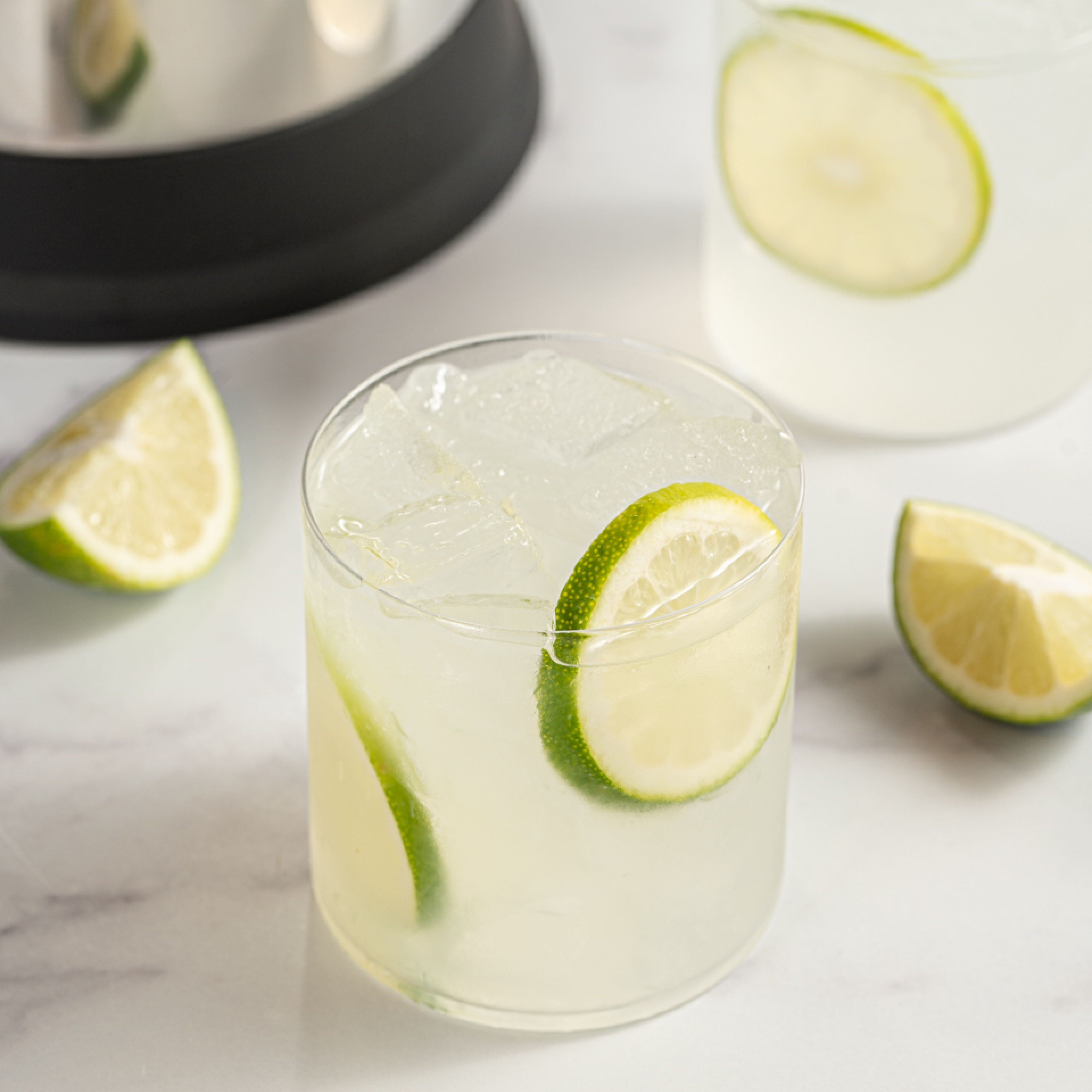 caipirinha cocktail in a glass garnished with lime slices