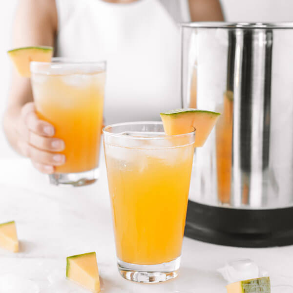 glasses of Cantaloupe Agua Fresca made with an almond cow