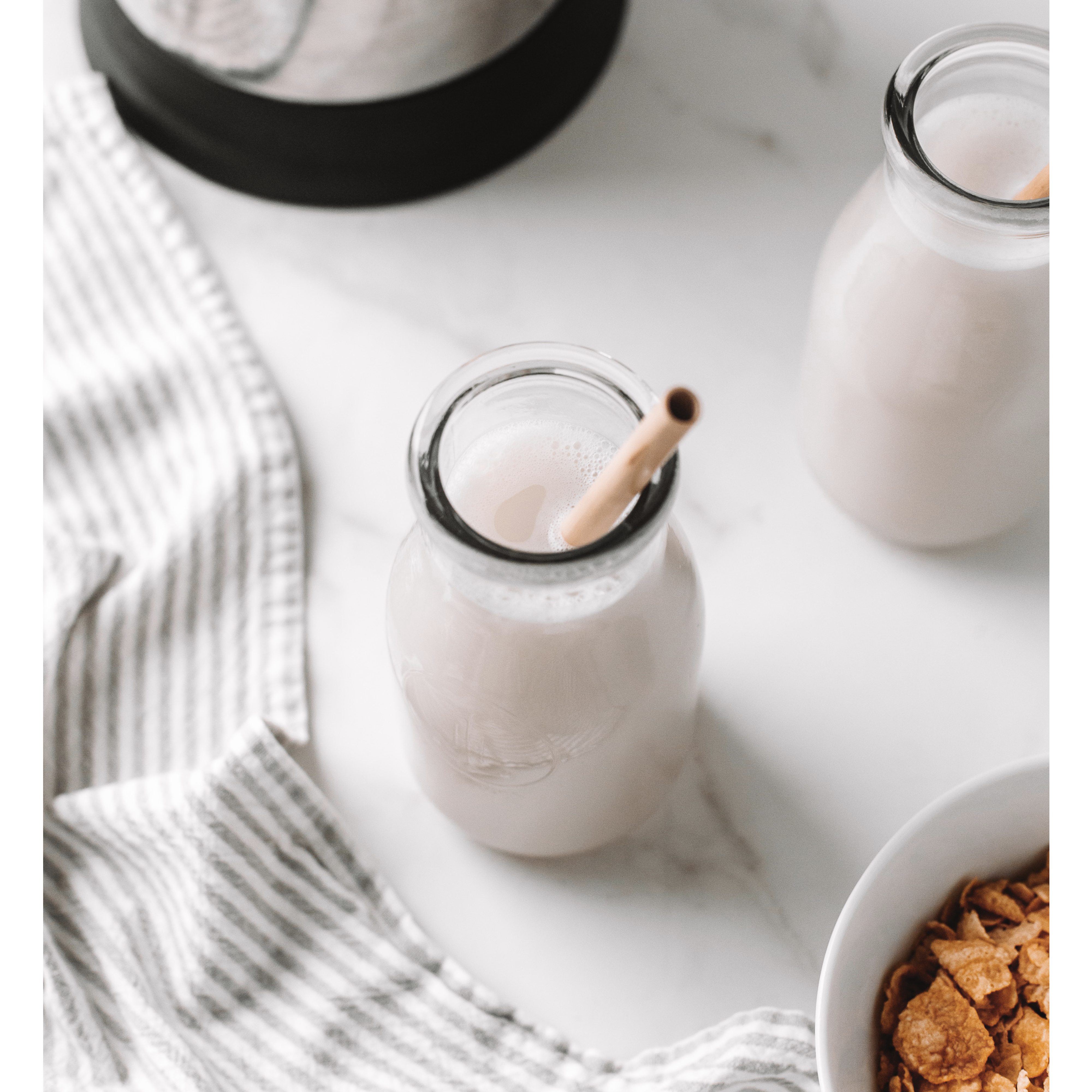 vegan homemade Cereal Milk in a glass with a straw