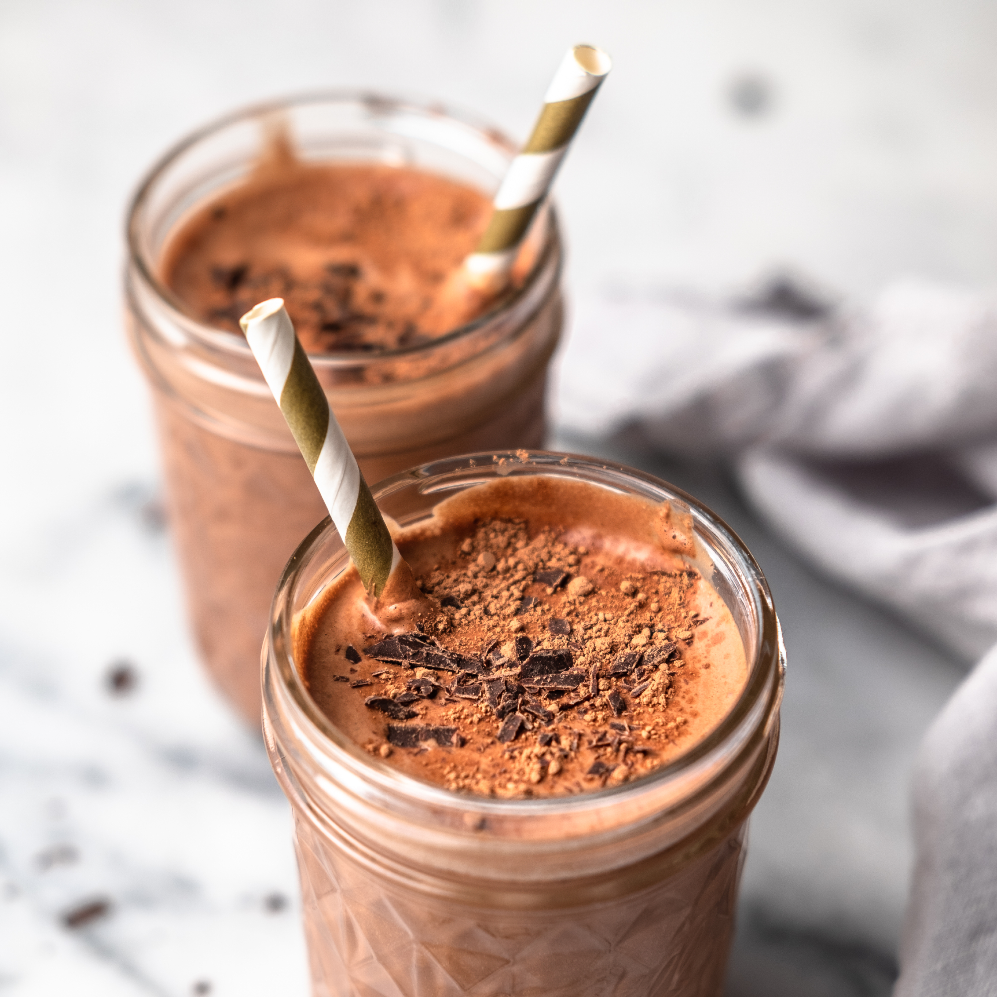 Chocolate Milk in two glasses with straws