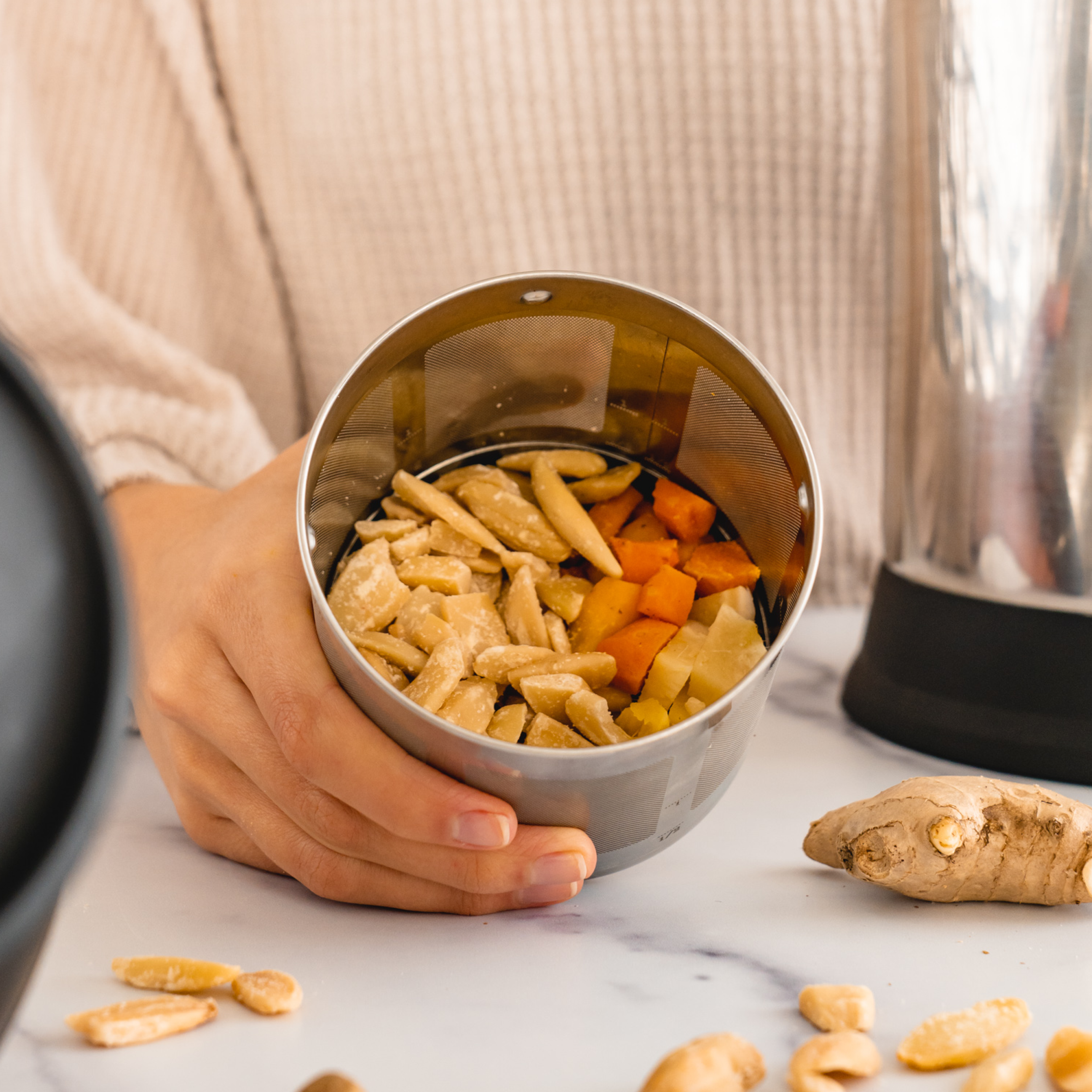 turmeric, ginger, pili nuts in a Almond Cow filter basket