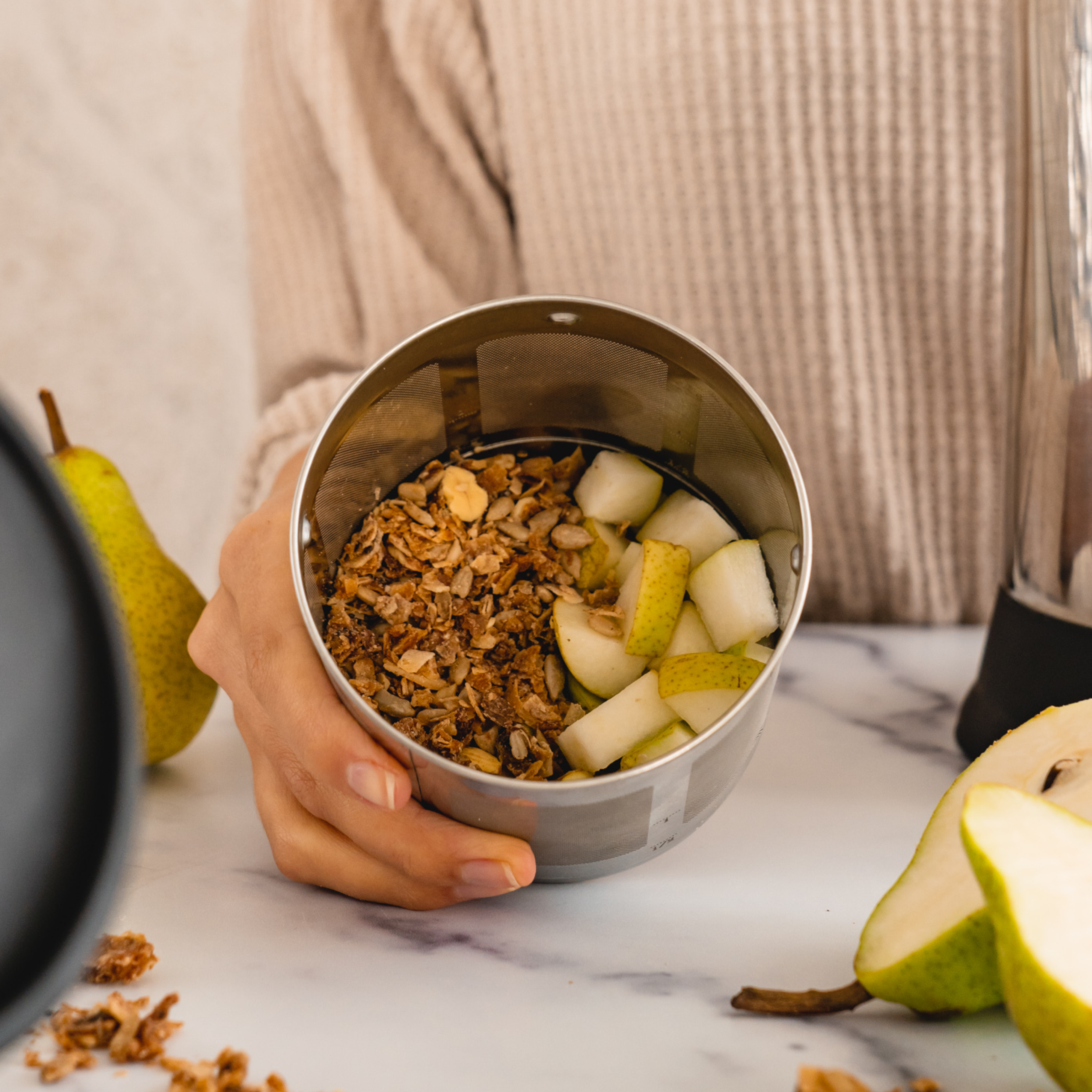 granola and chopped pears in a Almond Cow filter basket