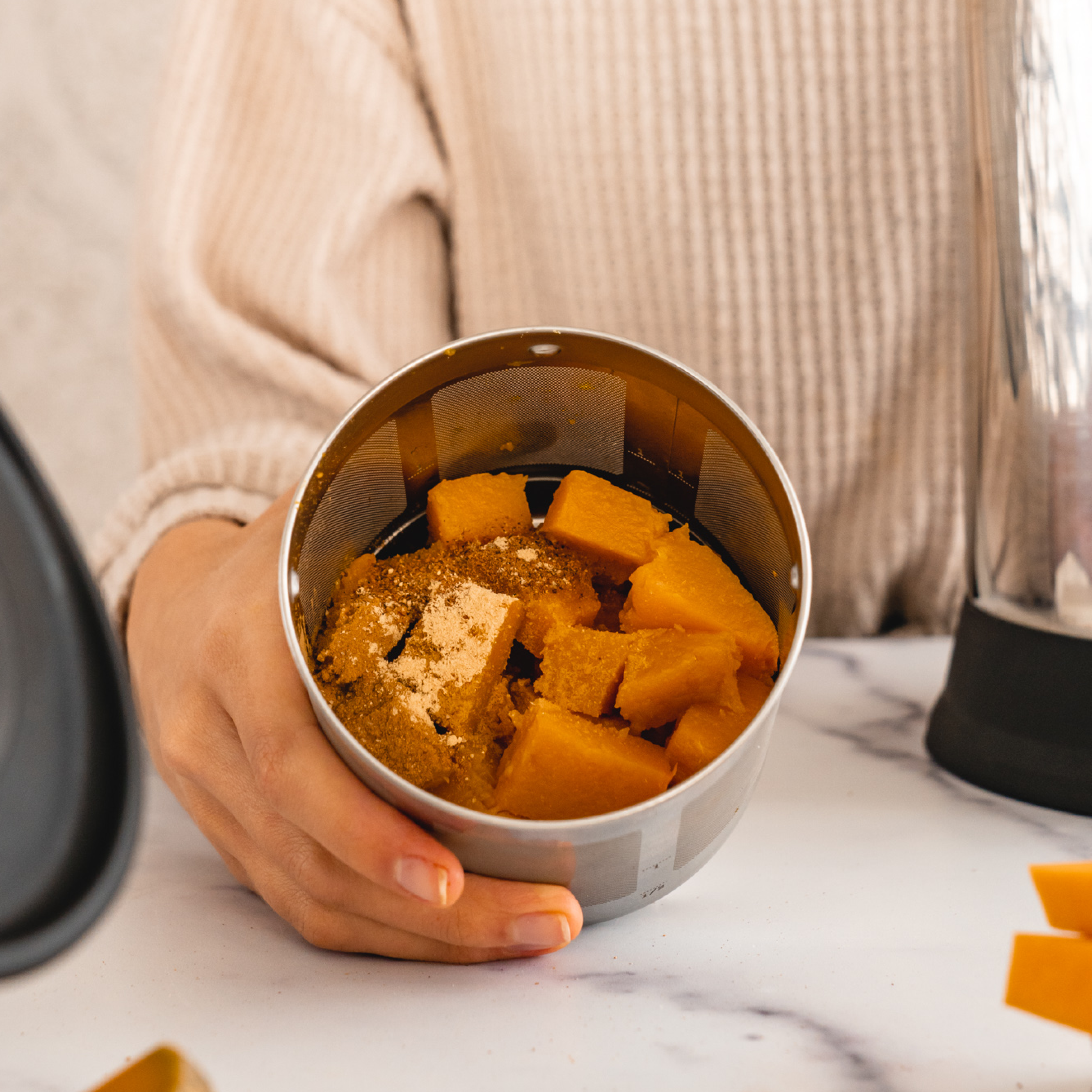 cooked pumpkin and spices in an Almond Cow filter basket