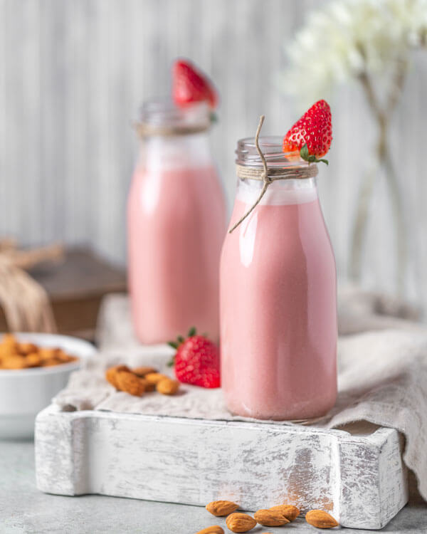 Strawberry Red Beet Almond Milk in two glasses
