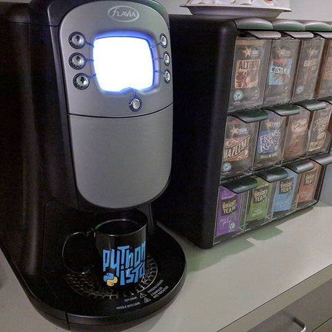 Pythonista mug sitting in a coffee machine
