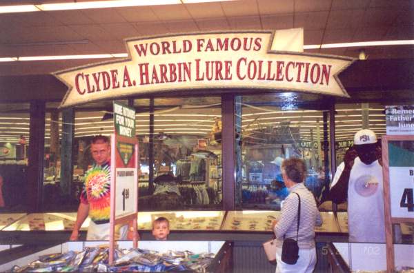 Above - Mrs. Clyde A. Harbin Sr. in the center enjoying the Bass Pro Shops lure display