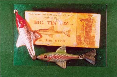 Two Big Tin Liz or Musky lures with the correct cardboard box.  The Red Head lure never had a Tail Fin.