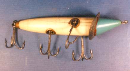 1904 or earlier Dowagiac No.2 or Slope Nose.  The 1905 Heddon catalogue did not offer a 4 - hooker.