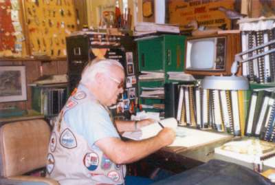 Clyde taking notes at his desk