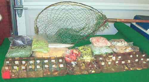 The "Candy Store Spare Parts" supply for Mr. Harbin and friends.  Take notice of the landing net with a new net.  Mr. Harbin has owned this net since 1954.  The solid color skirts and the dual colored skirts were obtained from Mrs. Ben Bacon, Ridge Runner Lures in Shreveport, La.  Her husband made many collectible wood lures.  The Candy Store remains in the Mr. Harbin's garage in Memphis, however in his traveling days it traveled along with the Bassman.