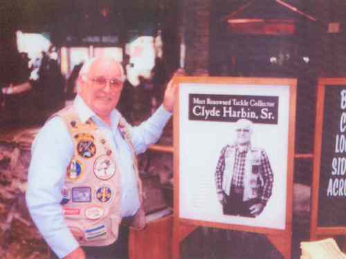 February 27, 1997 a visitor to the Bass Pro Shops in Springfield, MO. for the "Spring Fishing Classic" took this photograph of Mr. Harbin along side the one that Rick Collins, Wildlife Operations Manager had gotten from the 2nd Edition of Carl Luckey's Value Guide and ID book.