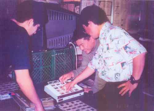 (Left) Mr. Takao (Center) Mr. Akira Yoshizawa, Photographer (Right) Mr. Naito