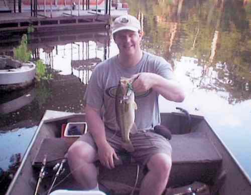 Tim Watts with a keeper bass caught with a "Water Walker" buzz bait.