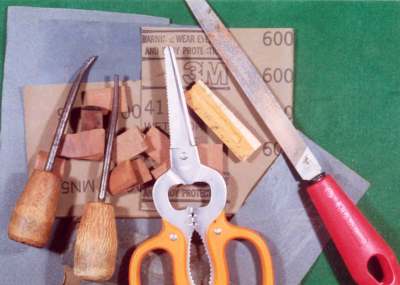 Wood pieces used with metal reed as locking devises in tone boards