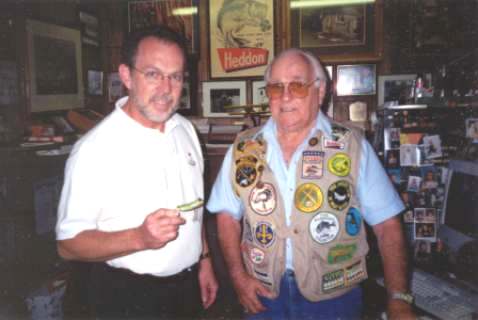 (Left) David R. Stalnaker (Right) Clyde A. Harbin Sr. preparing for an in hand inspection of a Heddon Frog.