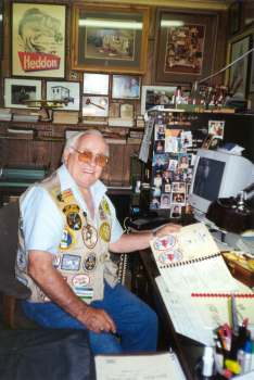 May 24, 2000  Mr. Clyde Harbin Sr. at his new desktop after acquiring his computer in December 1999. Clyde's old desk top housed old lure information books that were stacked in milk cases across the entire desk two cases high.  Clyde A. Harbin Sr. signed a gift copy of The NFLCC Springfield, Missouri Events for David R. Stalnaker.  You too can read about the NFLCC Springfield Events by clicking on the link below.