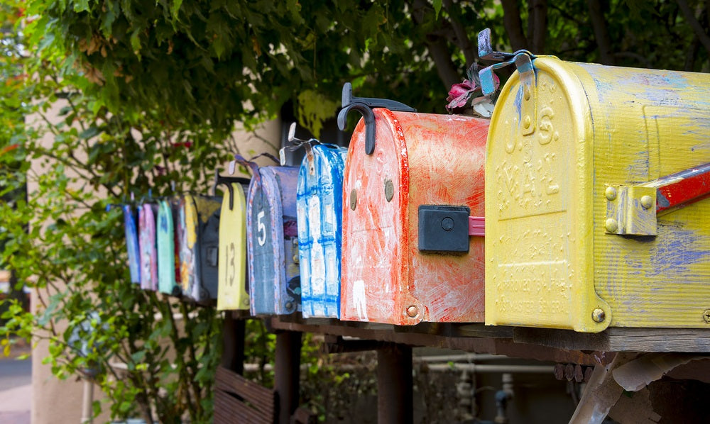 Colorful antique mailboxes on Canyon Road in Santa Fe, NM