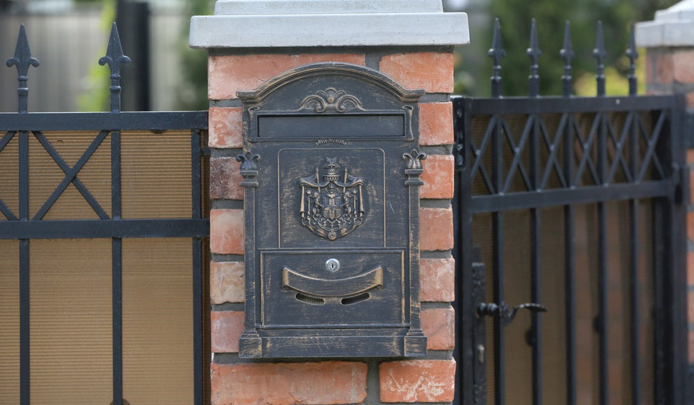 Mail metal box on a brick wall