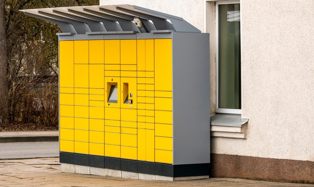 yellow parcel pick up station on the street