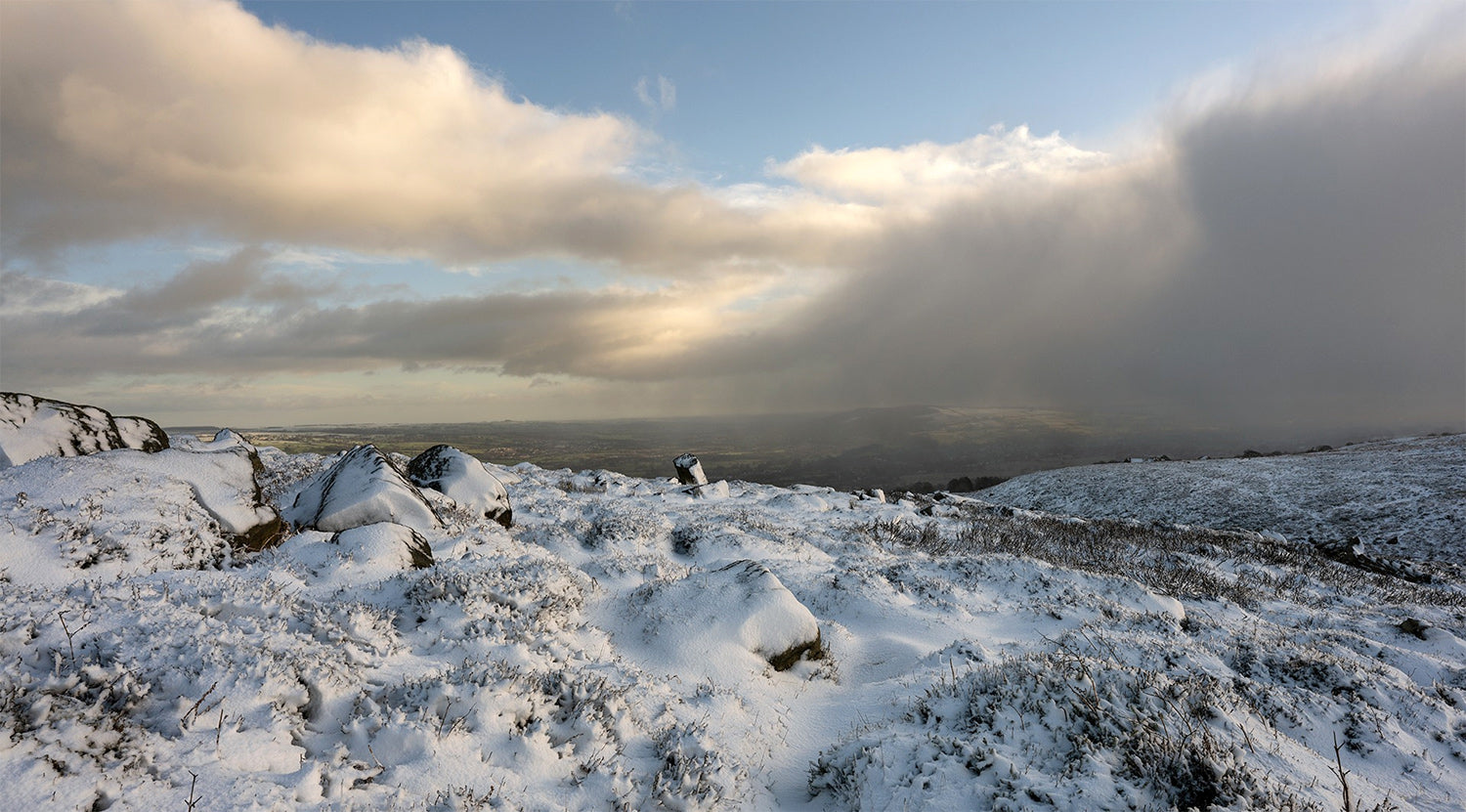 Snow and weather front over IIlkley Moor Burley Woodhead